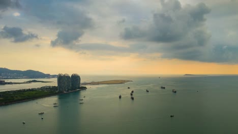 hora-del-atardecer-sanya-bay-famoso-isla-panorama-aéreo-timelapse-4k-china