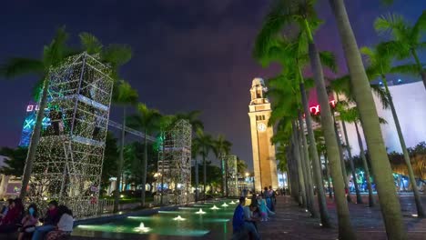 Parque-de-luz-torre-del-reloj-de-la-noche-China-caminando-panorama-4k-lapso-de-tiempo