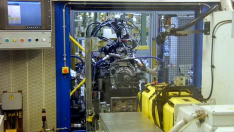 quality-control-of-car-engine-on-production-line,-at-an-automobile-factory