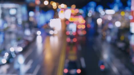 Traffic-jam-on-a-highway-at-night,-out-of-focus