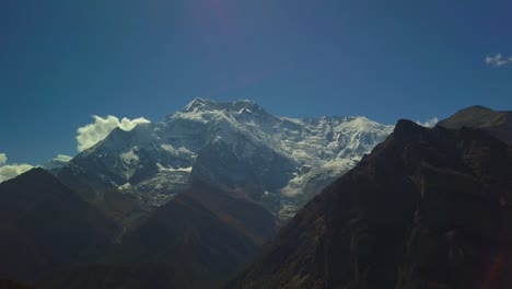 Sunrise-above-peak-in-the-Himalaya-range,-Nepal