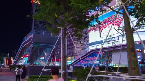 night-illuminated-shenzhen-city-famous-shopping-block-crowded-panorama-4k-time-lapse-china