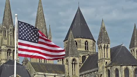 American-Flag-Waving-in-the-Wind,-Caen-City-in-Normandy,-Slow-Motion