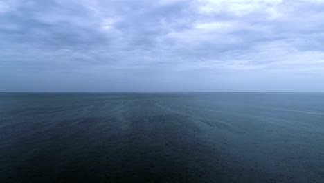 The-flight-above-the-sea-surface-on-the-picturesque-cloud-stream-background