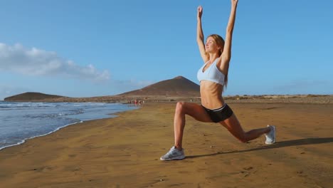 Yoga-retreat-and-training---woman-in-yoga-pose-at-beach-at-sunrise.-Female-yoga-girl-working-out-training-in-serene-ocean-landscape.-SLOW-MOTION-STEADICAM