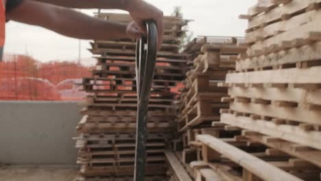 Latino-Manual-Worker-Working-With-Pallet-Stacker-In-Construction-Site