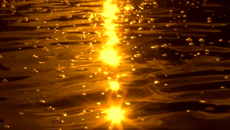 Golden-sunlight-sparkling-on-rippled-water