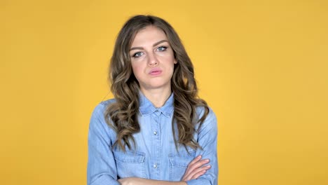 Sad-Upset-Young-Girl-Isolated-on-Yellow-Background