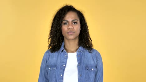 African-Girl-with-Frustration-and-Anger-Isolated-on-Yellow-Background