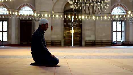 Young-adult-caucasian-man-praying-and-worship-at-the-mosque