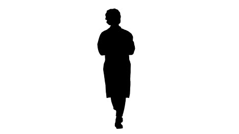 Silhouette-Friendly-female-doctor-walking-and-talking-to-camera