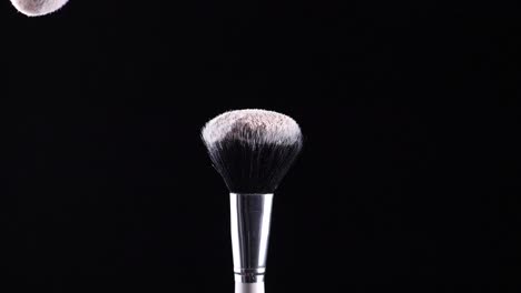 two-make-up-brushes-collide-creating-an-explosion-of-colored-powder-4