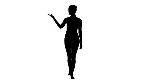 Silhouette-Young-blonde-woman-walking-and-pointing-to-side-showing-on-something