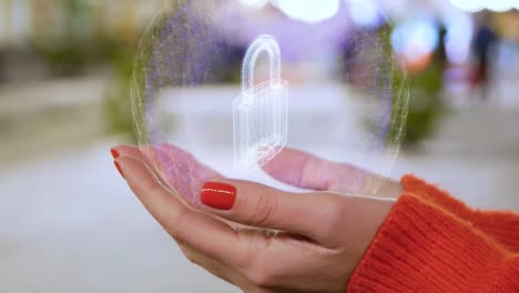 Female-hands-holding-a-conceptual-hologram-with-padlock