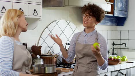 Women-Talking-in-Kitchen