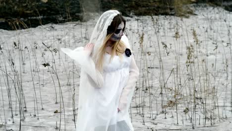 The-young-woman-with-scary-make-up-of-dead-bride-for-Halloween-in-white-dress.-4K