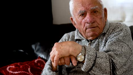 sad-depressed-old-man-holding-his-cane,portrait