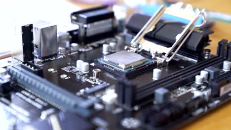 Engineer-sets-the-CPU-into-the-motherboard