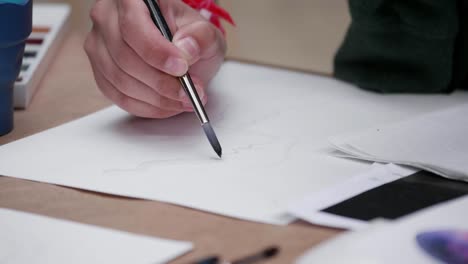 Artist's-Hands-Painting-with-a-Brush