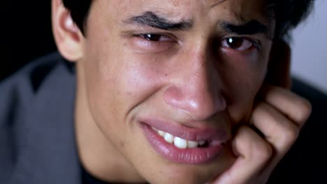 Sad-desperate-young-latin-man-crying-looking-at-camera.-Depressione,problems