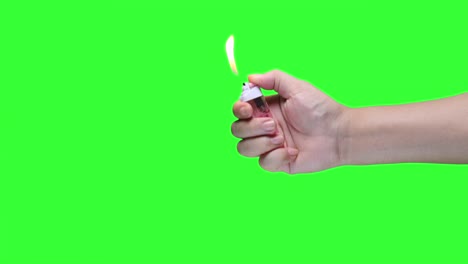 Hand-holding-lighter-on-green-screen-background