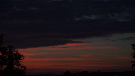 Time-lapse-of-a-red-sunset-sky-going-to-night