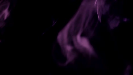 Purple-Steam-Rises-from-up.-Blue-smoke-over-a-black-background.-Smoke-slowly-floating-through-space-against-black-background.-4K-UHD