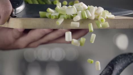 Falling-of-green-onion-into-the-frying-pan.-Slow-motion-480-fps