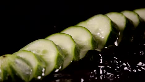 Falling-of-sliced-cucumber-into-the-wet-table.-Slow-motion-480-fps