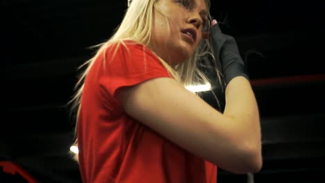 Beautiful-blonde-after-workout-takes-off-gloves.-Closeup