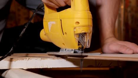 Man-working-with-jig-saw