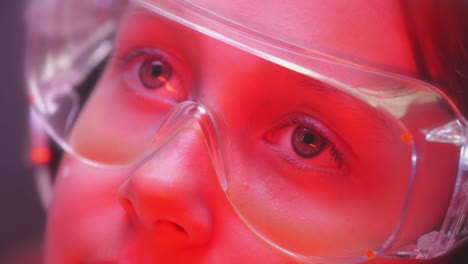 Portrait-of-a-young-girl-researcher-with-safety-glasses.