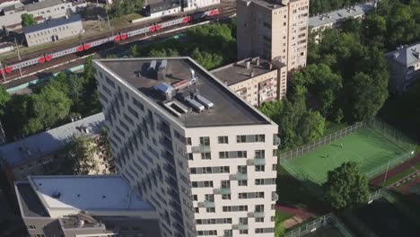Drone-footage-of-exterior-apartment-building.-Development-infrastructure-city-for-big-population,-modern-skyscrapers-and-tall-edifices-of-megapolis,-urban-transportation-system.