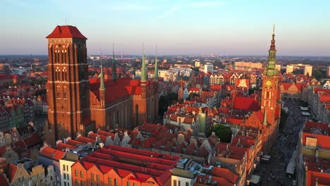 Gdansk-old-city-in-the-rays-of-the-rising-sun,-aerial-view-of-the-old-city-streets