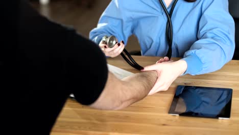 Female-doctor-measure-blood-pressure,-close-up-FullHD