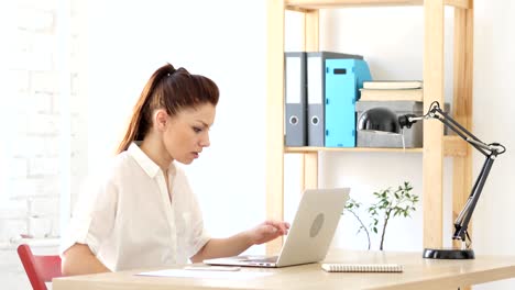 Woman--Yelling-while-Working-on-Laptop