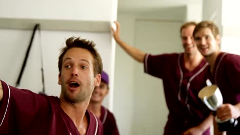 Baseball-players-taking-a-selfie-on-mobile-phone-in-dressing-room