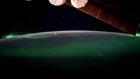 Earth-and-Aurora-Borealis-from-ISS.-Elements-of-this-video-furnished-by-NASA.-8K-Timelapse