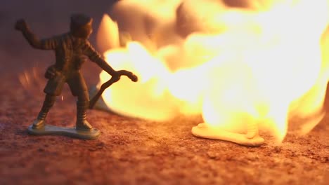 toy-soldier-in-the-fire.-The-model-of-the-battle-scene.-The-concept-of-the-death-of-war
