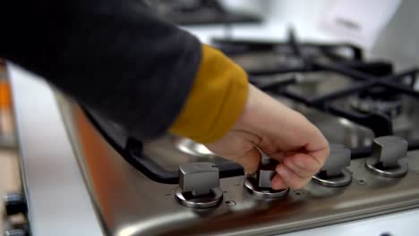 A-young-woman-chooses-a-gas-stove-in-a-home-appliance-store.