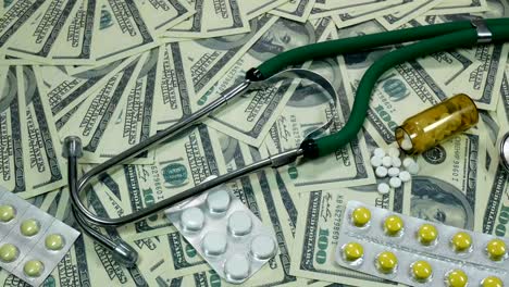 Slider-Shot-Of-Dollar-Bills-And-Medicine-On-The-Table