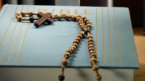 Wooden-Rosary-on-the-Bible.-Panning