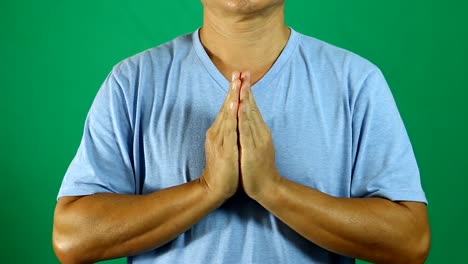 Man-praying-with-green-background