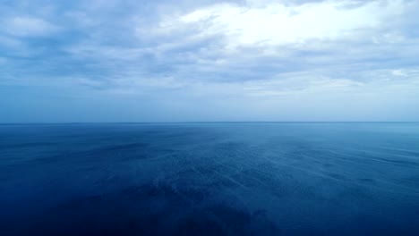 The-flight-above-the-ocean-on-the-cloud-flow-background