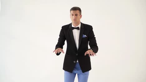 a-man-in-a-black-jacket-is-depicting-play-the-piano-on-a-white-background-in-the-studio.