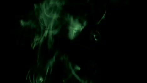 Green-Steam-Rises-from-up.-Blue-smoke-over-a-black-background.-Smoke-slowly-floating-through-space-against-black-background.-4K-UHD