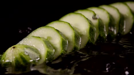 Falling-of-sliced-cucumber-into-the-wet-table.-Slow-motion-240-fps