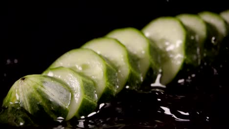 Falling-of-sliced-cucumber-into-the-wet-table.-Slow-motion-480-fps