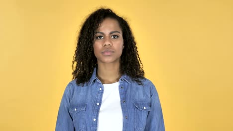 Screaming-Angry-African-Girl-Isolated-on-Yellow-Background