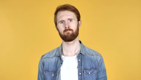 Sad-Upset-Redhead-Man-Isolated-on-Yellow-Background